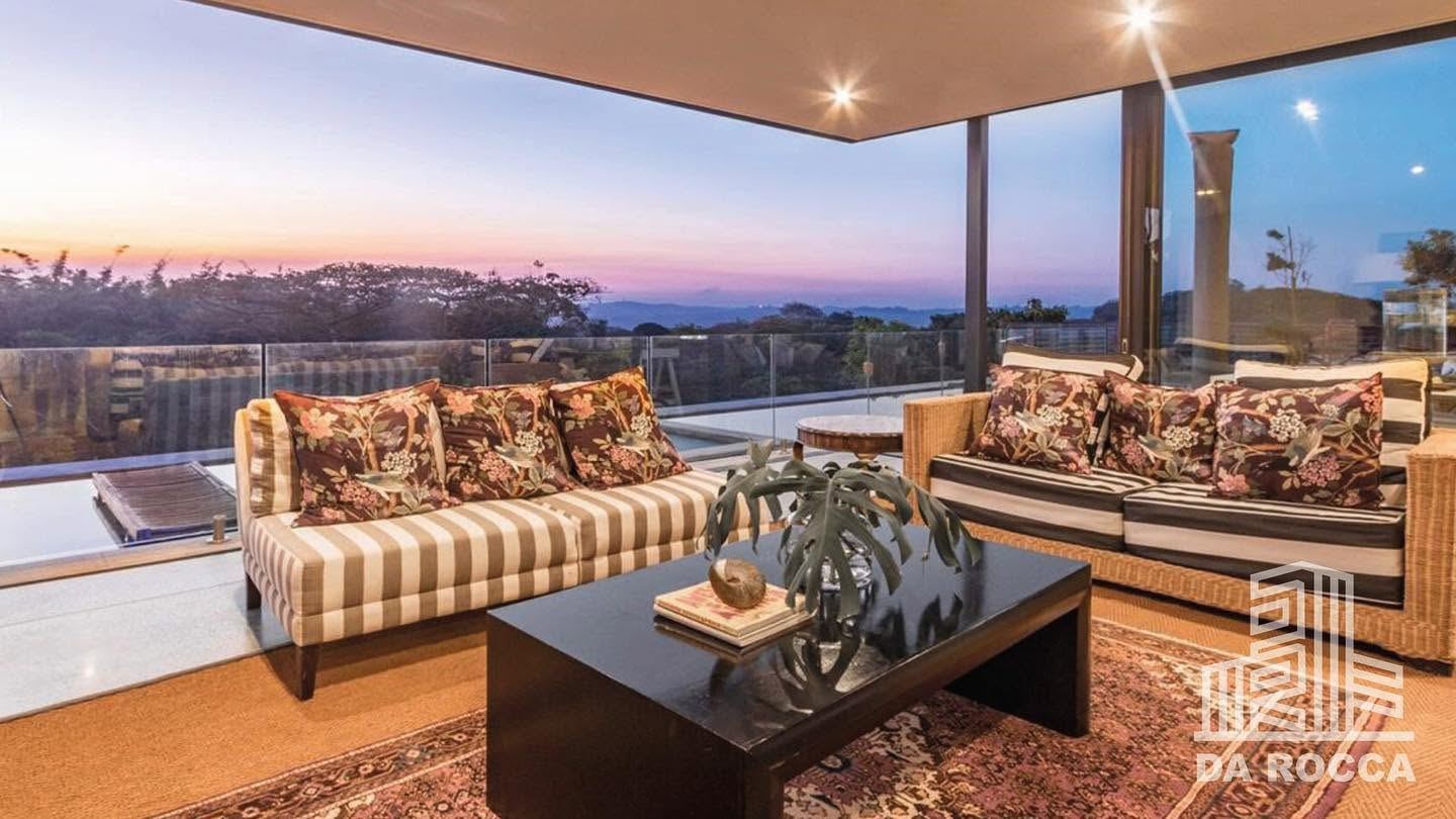 Renovated living room with sunset ocean view