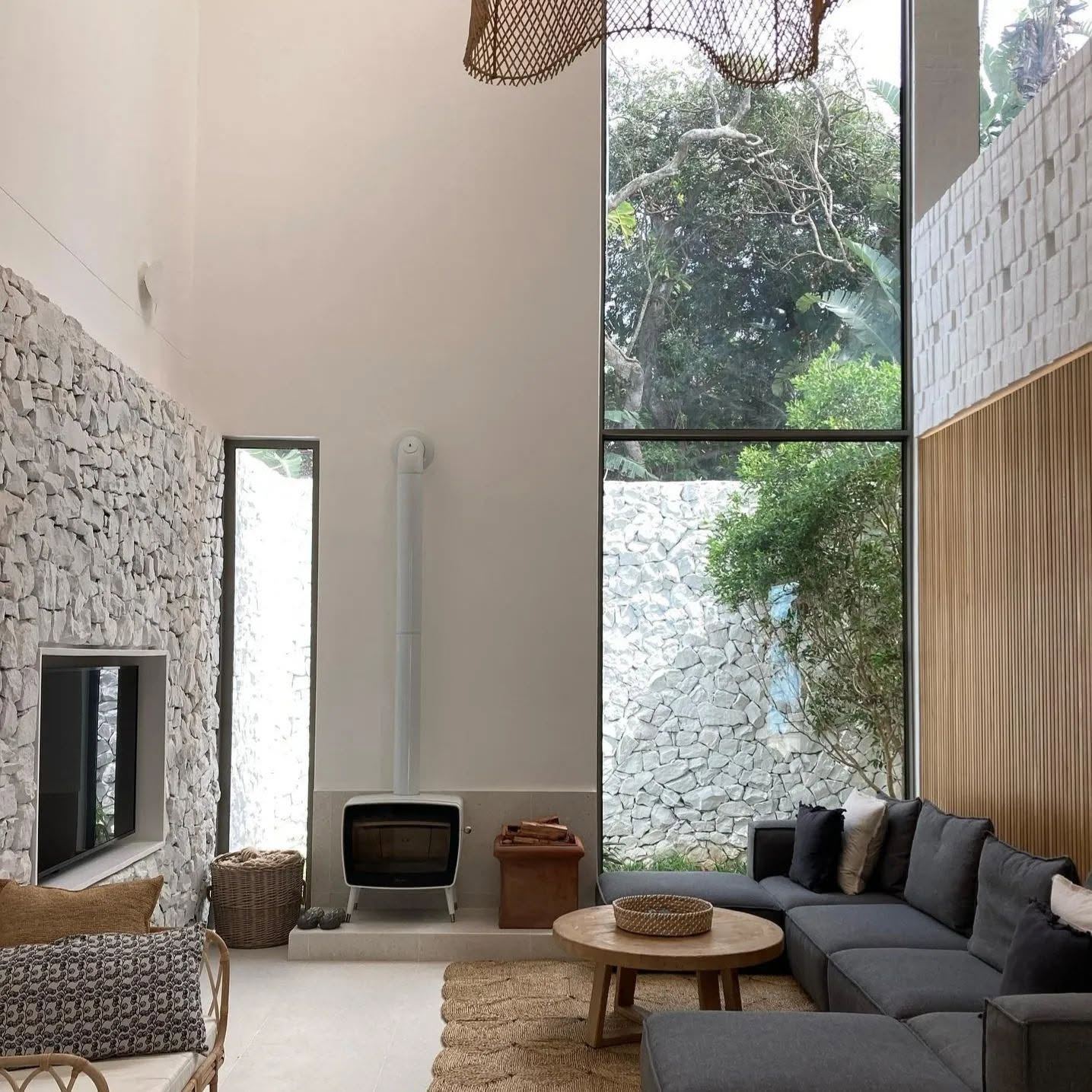 Renovated living room with feature stone wall