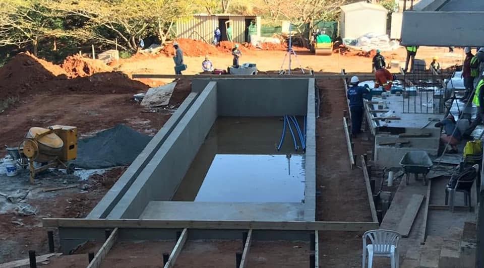 Pool being constructed on an active building site