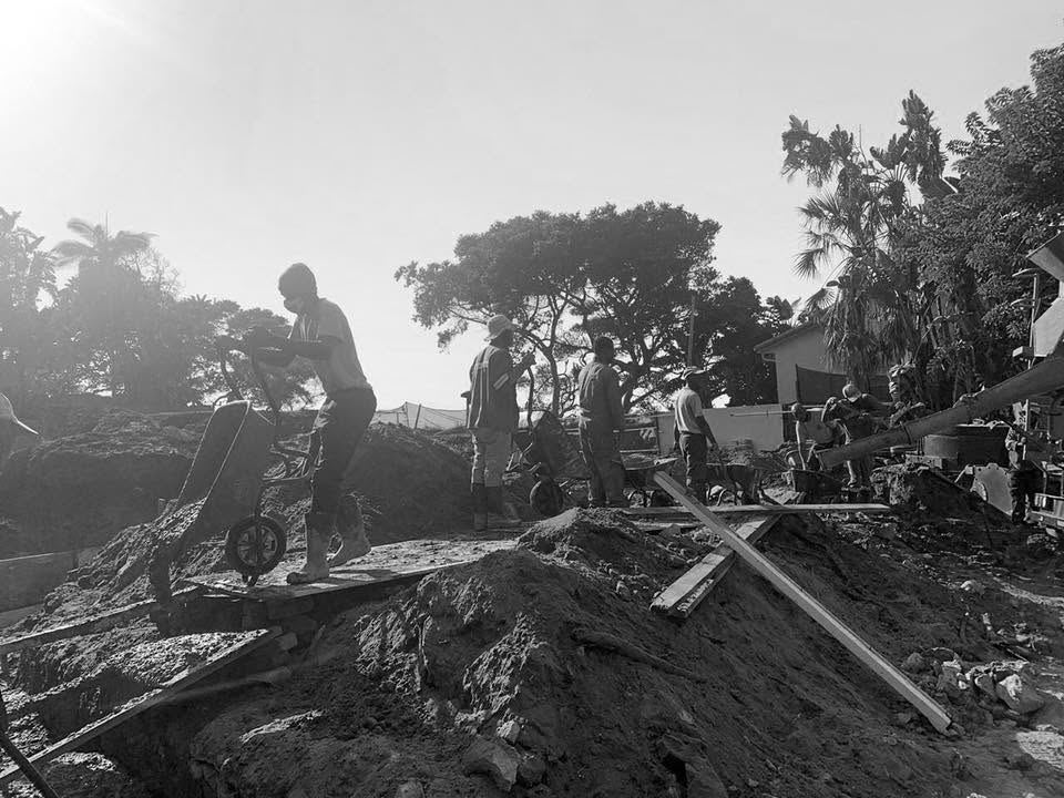 Construction site being cleared, black and white photograph